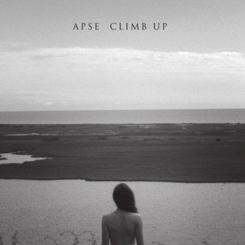 Black and white vinyl album cover featuring a woman standing by a body of water.
