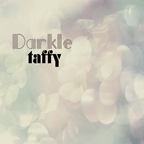 The image shows a soft, blurry floral background with the text "Darkle Taffy" in the top-left corner. Alt text: Blurred floral pattern with "Darkle Taffy" text overlay in stylized font.