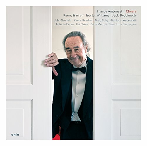 Man in tuxedo peeking from white door on vinyl album cover with listed featured artists.