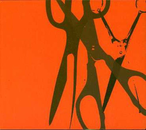 The image depicts a pair of scissors cutting through an orange background with a dark green silhouette. Alt text: Orange background with dark green scissors silhouette and a cut edge.