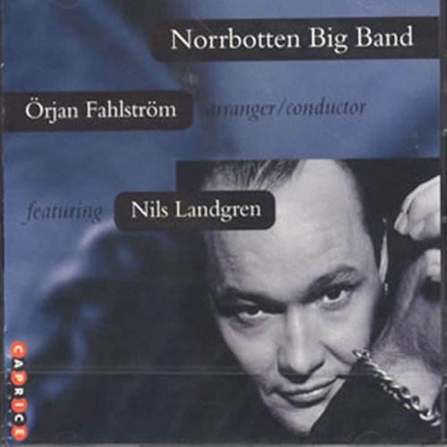 "Album cover with blue background, black and white photo of a man's face."