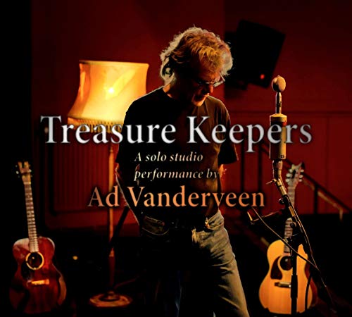 "Man with guitar in a dimly lit recording studio with text overlay."