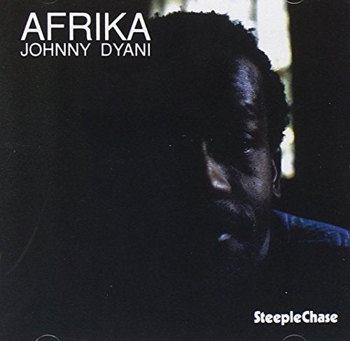 "Album cover with a dark portrait of Johnny Dyani and white text."