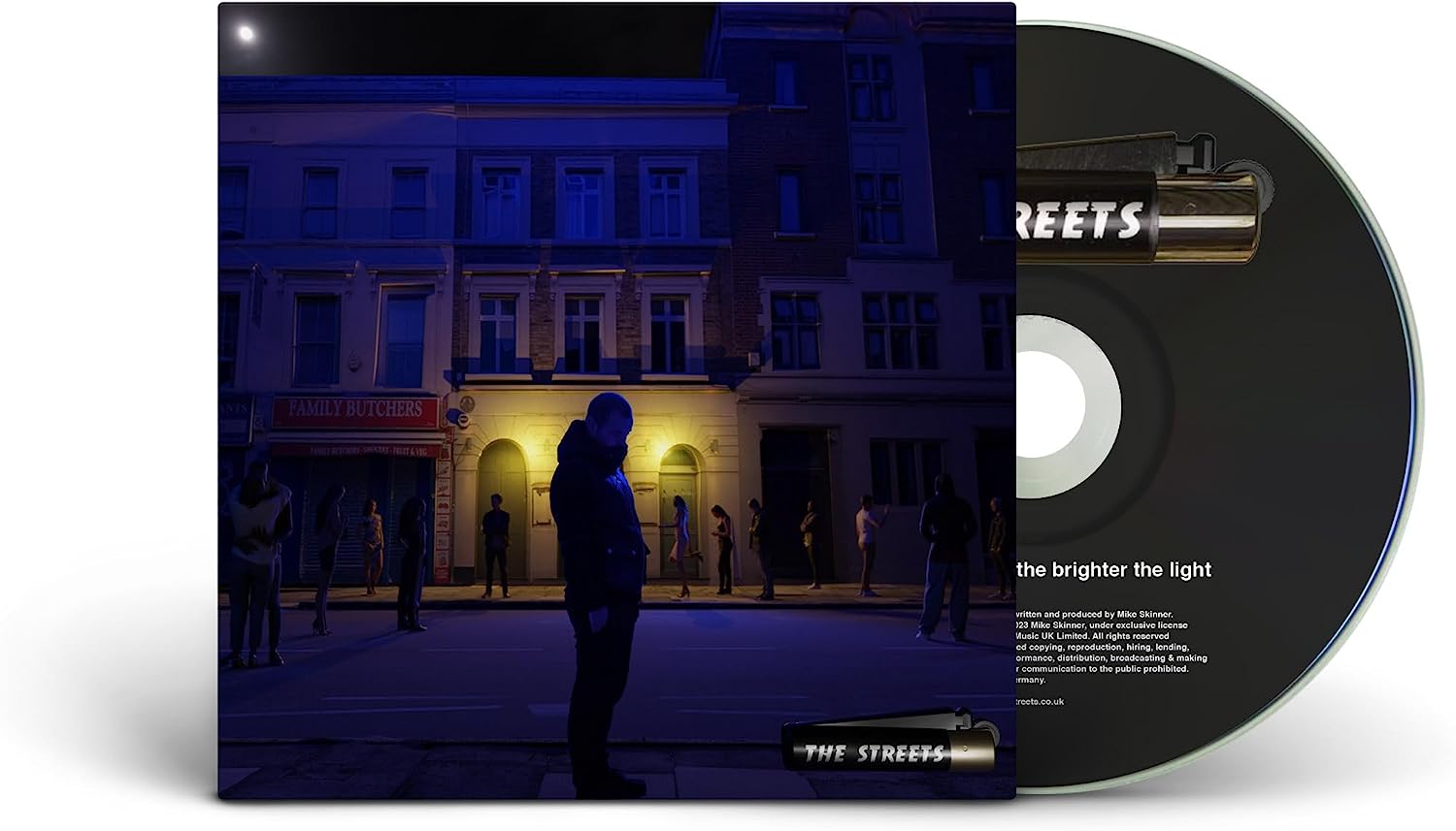"CD case with a dark street scene and a partially visible black CD."