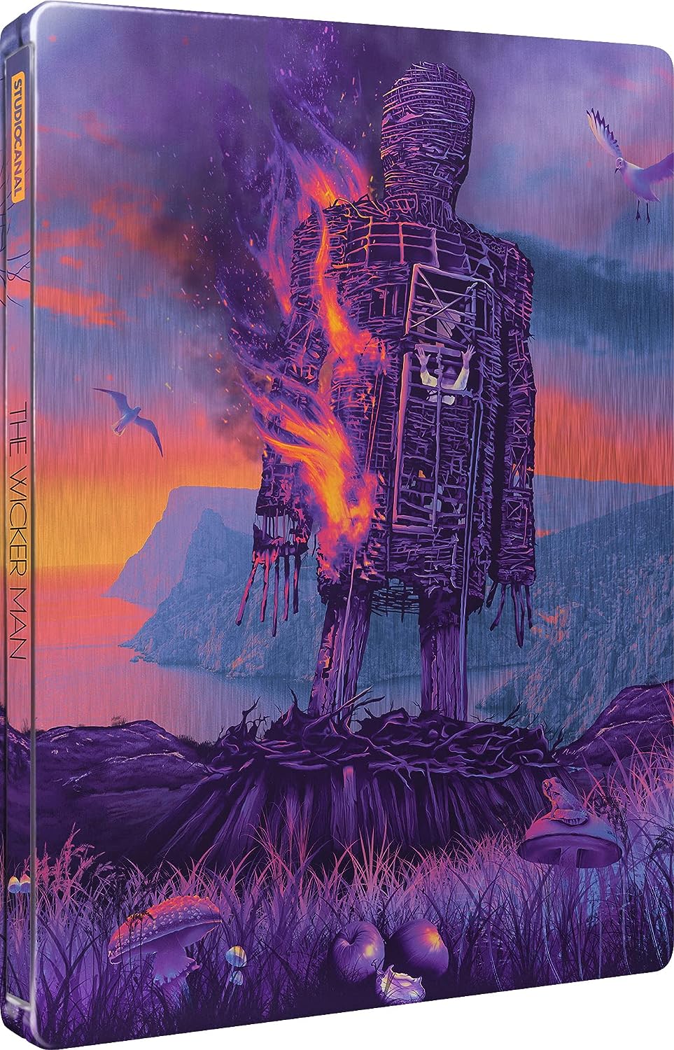 "Purple steelbook case with burning wicker man illustration and seagulls."