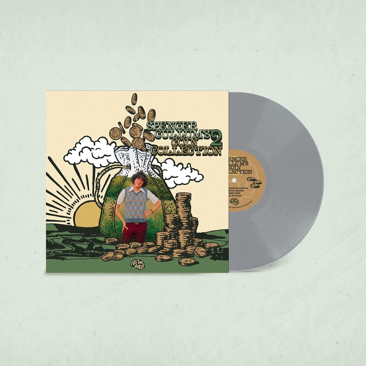 "Vinyl record with gray disc and illustrated album cover featuring a man and coins."