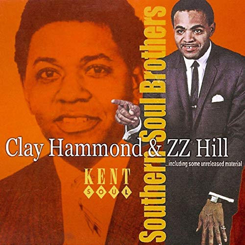 "CD cover featuring two men in suits with orange-toned images and yellow text."