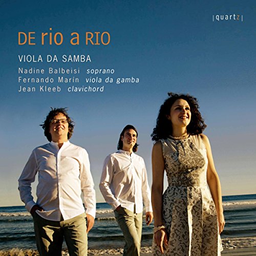"CD cover featuring three musicians standing on a beach with a blue sky."