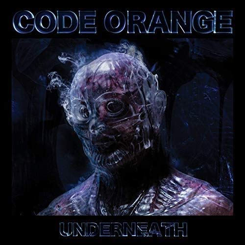 "Vinyl record with a black album cover featuring a grotesque figure and blue splatter design."
