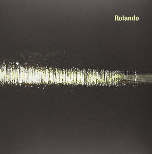 Black vinyl record sleeve with "Rolando" in yellow text and a white, sparkly streak.
