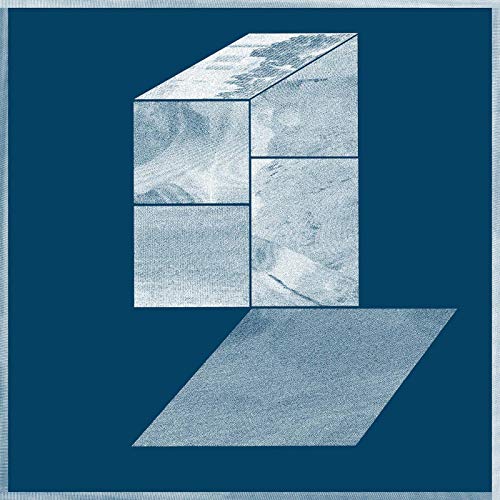 The image depicts a blue-toned vinyl record cover with a 3D cube design. alt text: "Blue vinyl record cover with 3D cube and shadow on blue background."