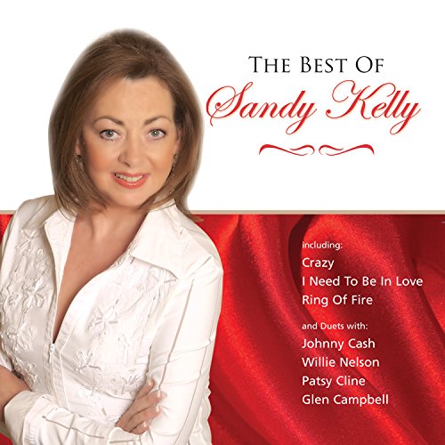 "Sandy Kelly album cover with a woman in white against a red fabric background."