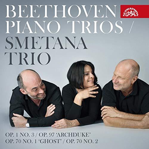 "CD cover featuring three musicians in black, smiling together, against a grey background."