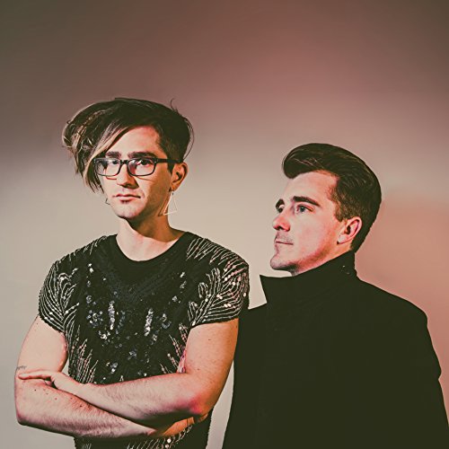 "CD cover featuring two men in black clothing against a gradient background."
