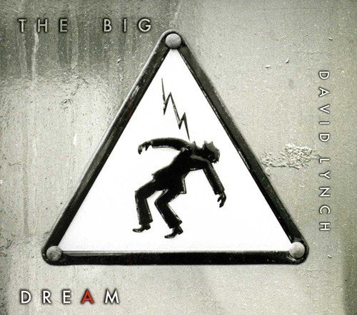 "Album cover with triangular warning sign featuring a man falling, on a grey background."