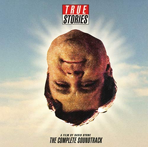 "Album cover with a torn head sculpture against a cloudy sky background."