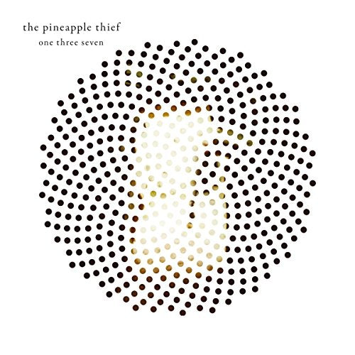 Album cover with a large circle of dots, gradient from black to white, on a white background.
