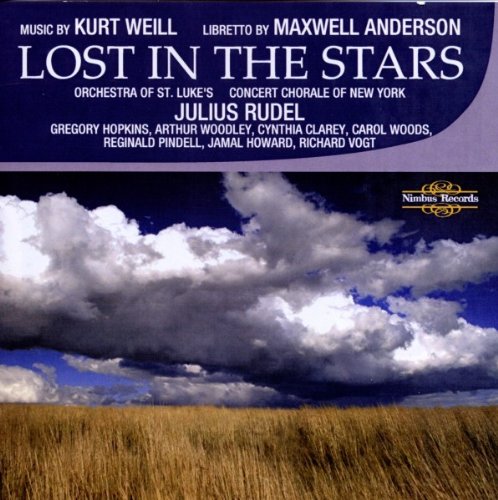 "CD cover with a field and cloudy sky, titled 'Lost in the Stars'."