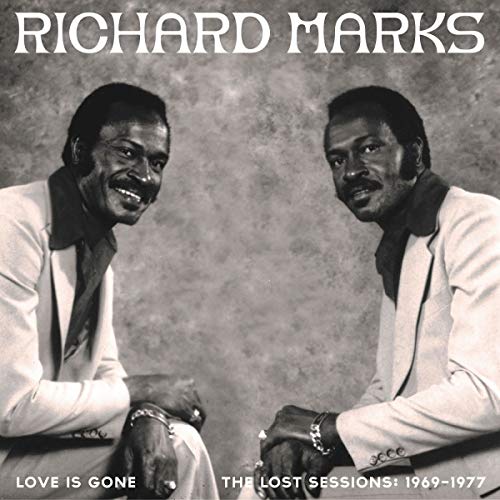 Black and white album cover featuring two men in white suits.