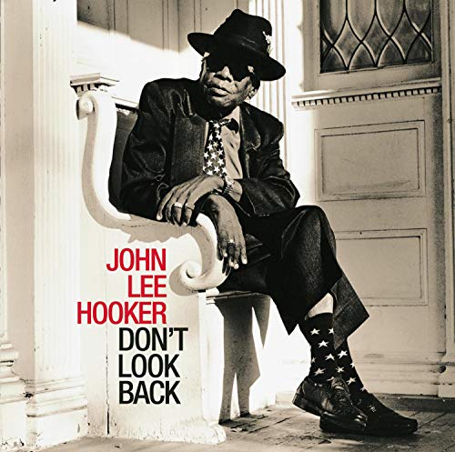 Album cover featuring John Lee Hooker sitting on a chair, wearing a hat and sunglasses.