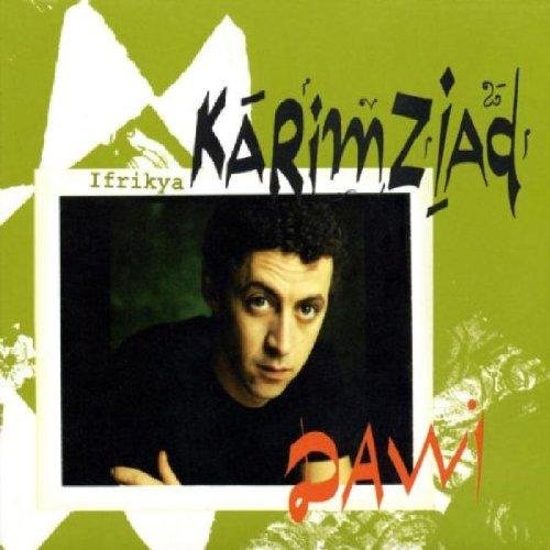 "Album cover with a man in a black shirt on a green background."
