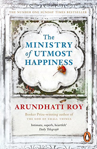 "Book cover with 'The Ministry of Utmost Happiness' title, author's name, and a ladybug."