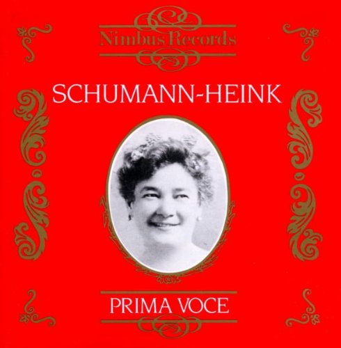 Red album cover with black-and-white portrait of a smiling woman, surrounded by green ornate designs.