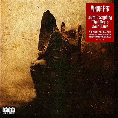 Vinyl album cover: hooded figure in a desolate, textured landscape.