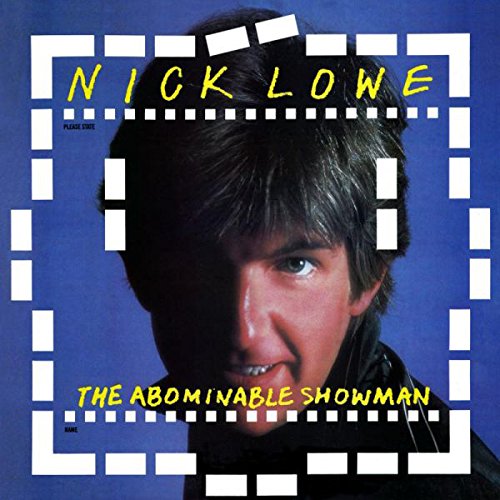 Nick Lowe's album cover featuring a man with dark hair against a blue background.