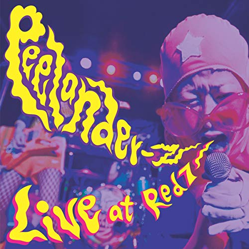 CD album cover with a man singing into a microphone, wearing sunglasses and a beanie.