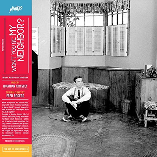 "Album cover with black-and-white image and red, blue, and yellow text panel."