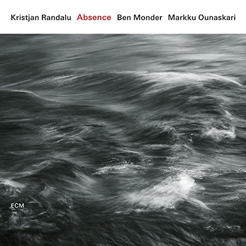 Album cover with dark, turbulent water and white accents, featuring artist names at the top.