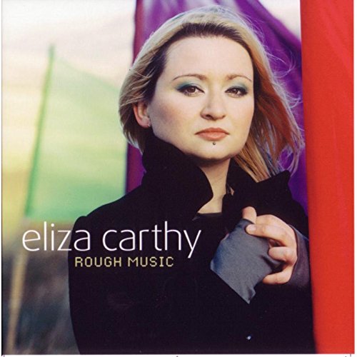 "Album cover featuring a woman in black, standing behind a red curtain."