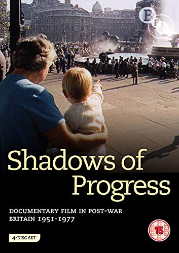 DVD cover with a man holding a child, looking at a fountain, on a black background.