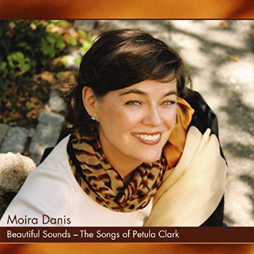 CD cover featuring a smiling woman with dark hair and a white shirt.