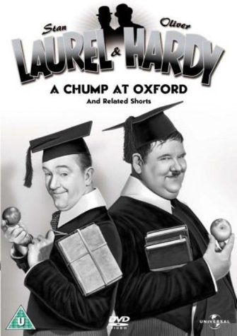 "Black and white DVD cover featuring Laurel and Hardy in graduation attire, back to back."