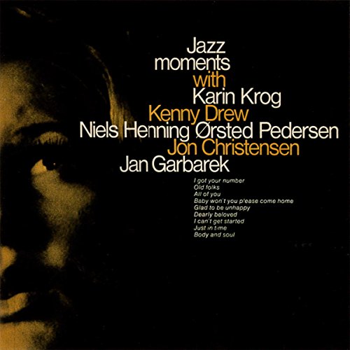 "CD cover with a woman's face and jazz artist names."