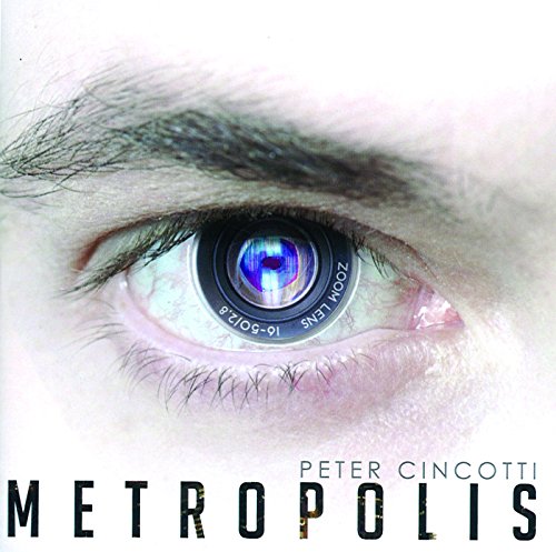 Album cover with a close-up of an eye reflecting a camera lens, titled "Metropolis".