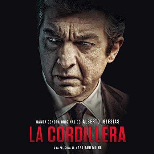"Album cover featuring a man in a suit against a black background."