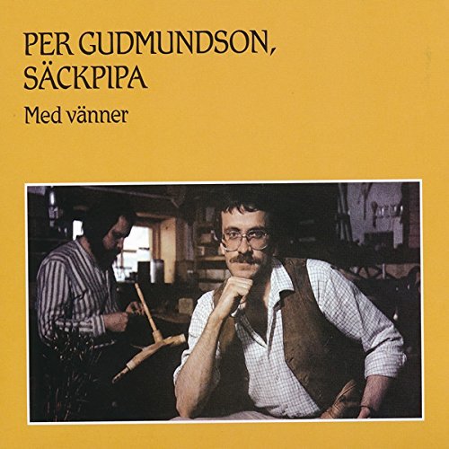 The image is a CD cover with a man sitting and another standing.