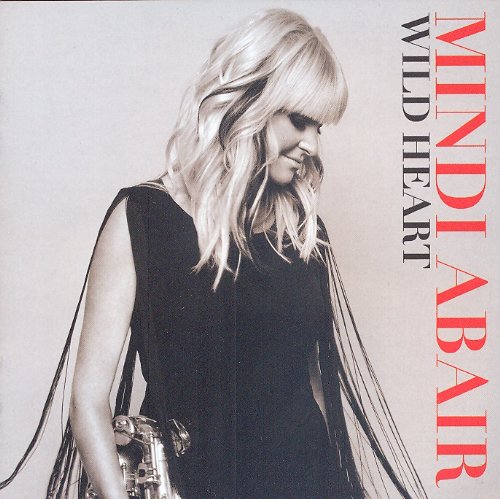 "Album cover with a woman holding a saxophone, titled 'Mindi Abair Wild Heart'."