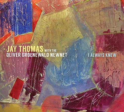 "Album cover with abstract, colorful background and artist/ title text."