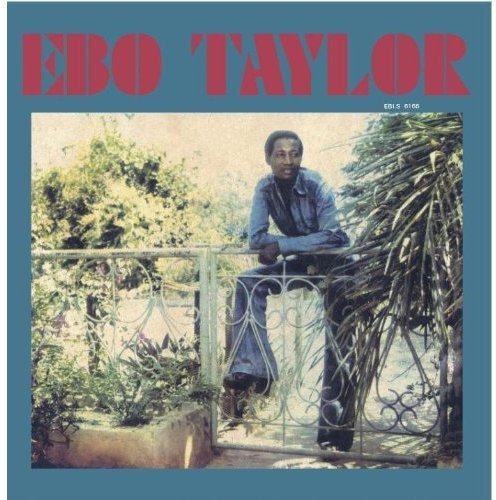 "Ebo Taylor album cover with a man leaning on a railing surrounded by plants."