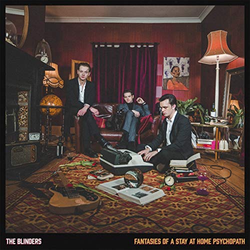"Album cover with three men in a cluttered room, surrounded by musical instruments."