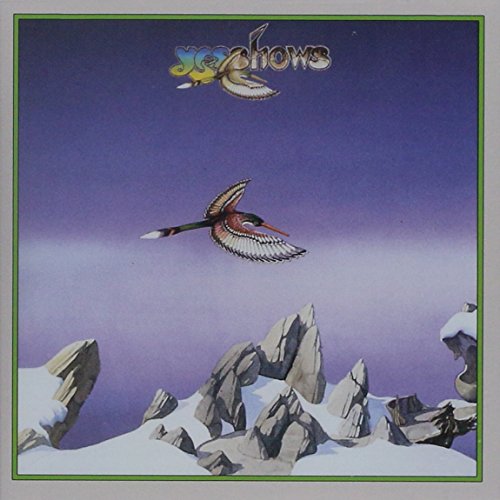 "Album cover art featuring a bird flying over snowy mountains with 'Yesshows' text."