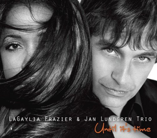 Black and white close-up of a man and woman, album cover with orange text.