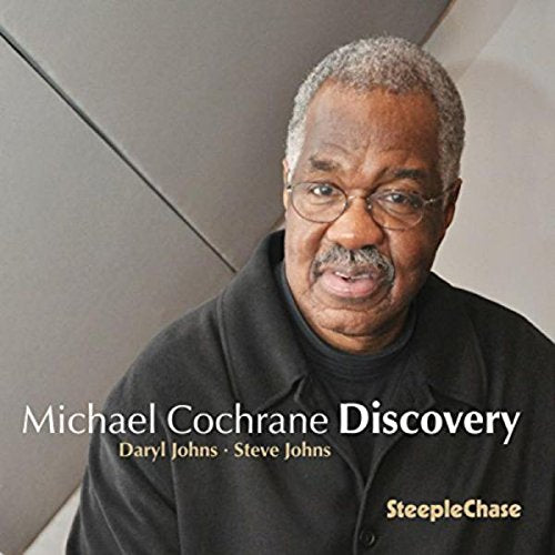 "Jazz album cover featuring a man with gray hair and glasses."