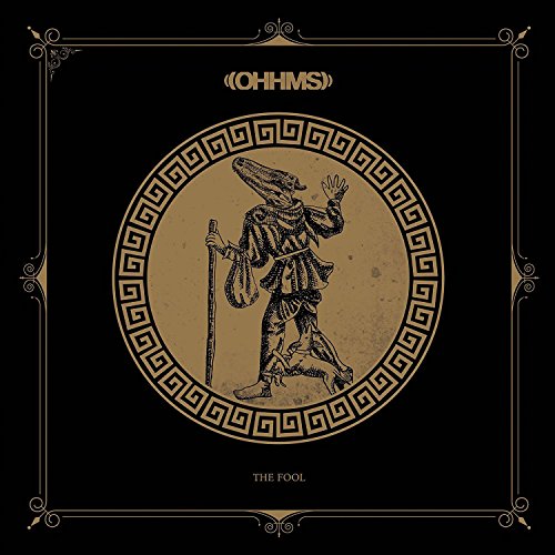 "Black album cover with gold illustration of a jester and Greek border."