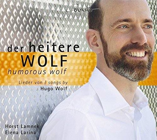 "CD cover featuring a smiling man with a beard and white shirt."