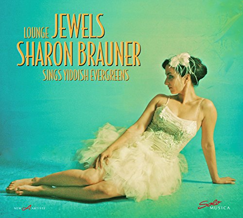 Album cover featuring a woman in a white dress sitting on a blue-green background.